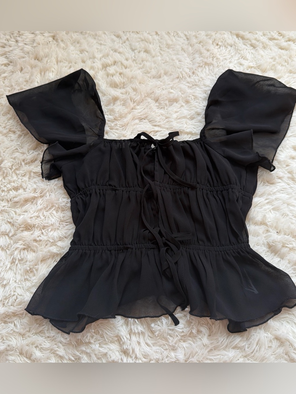 Motel Rocks Black sheer blouse with ruffled sleeves and tie front detail